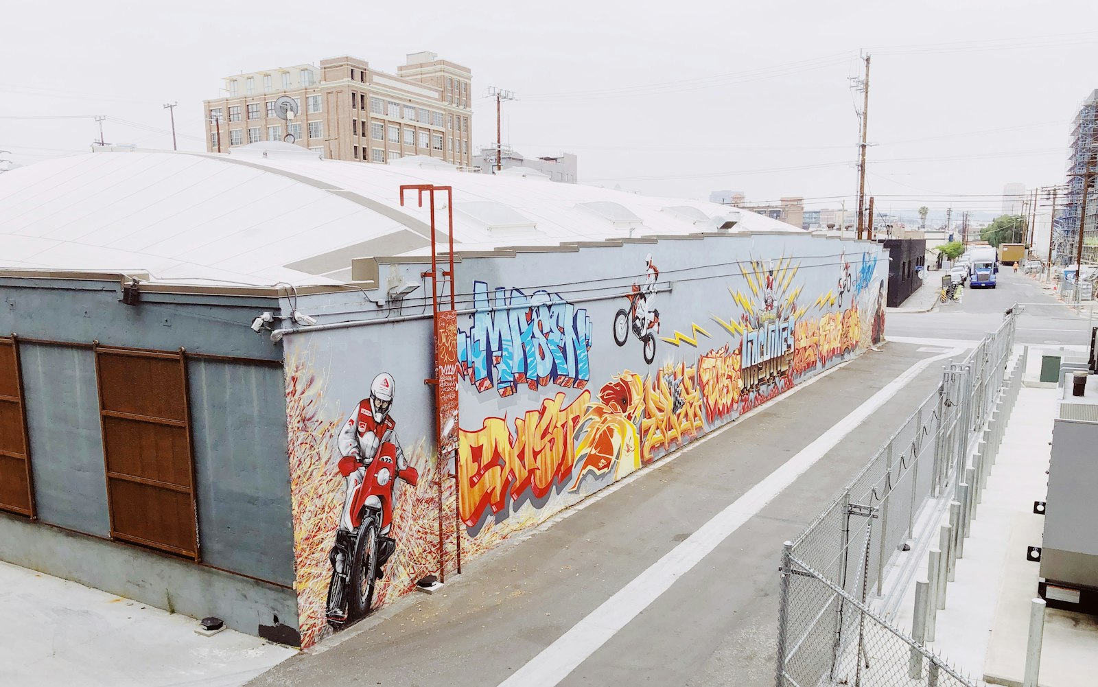 A colorful street mural in an arts district